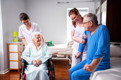 caregivers taking care of senior couple