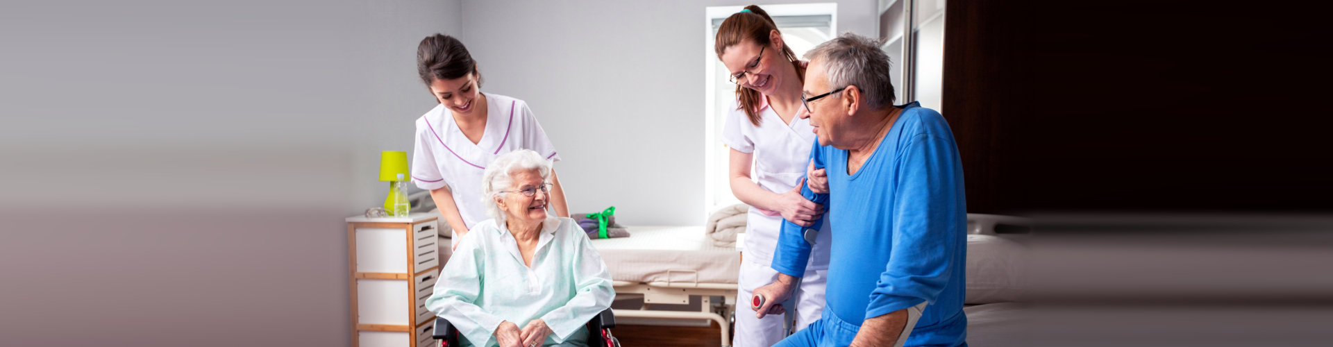 caregivers taking care of senior couple